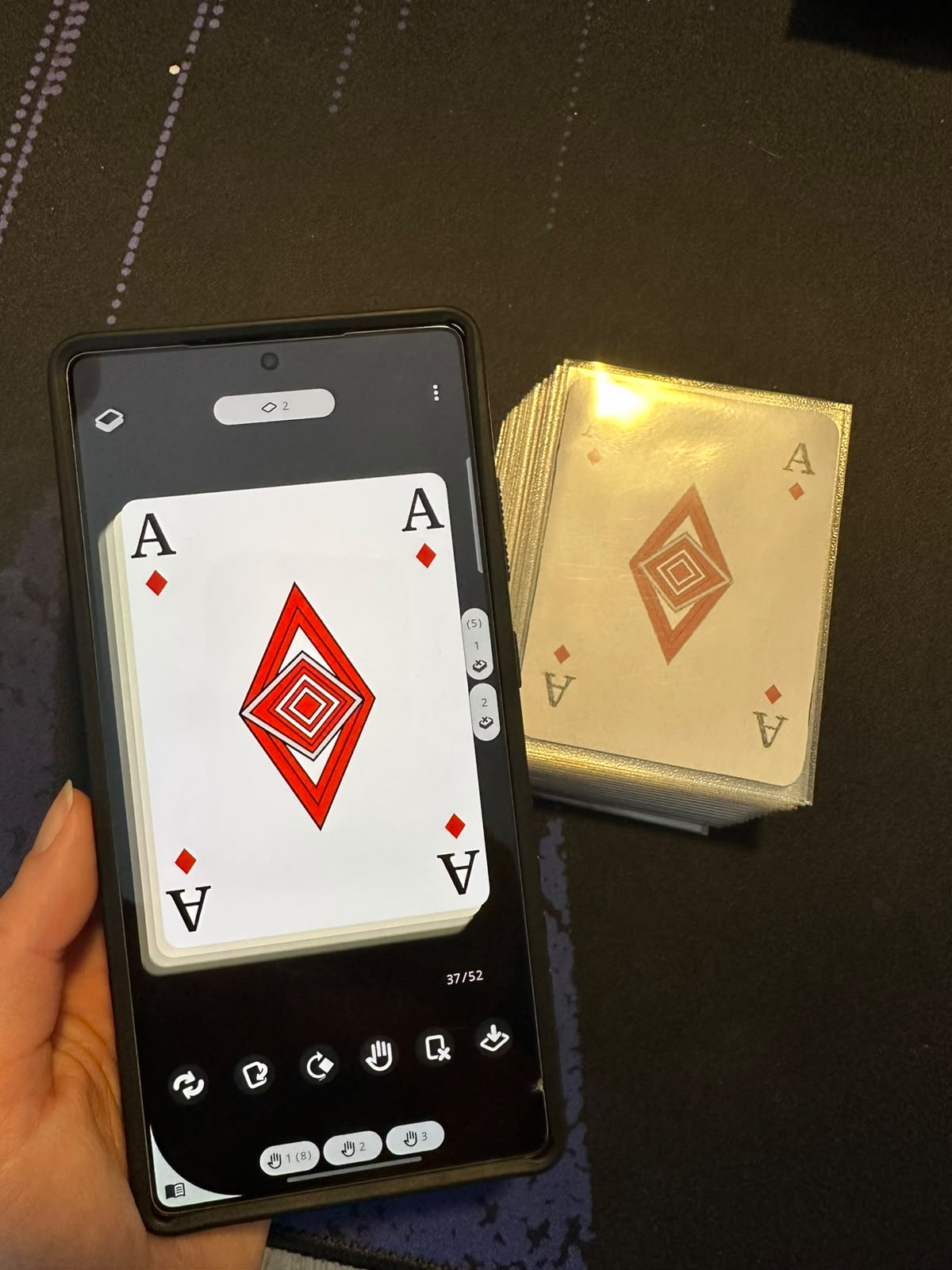 Flipping the top card during a simulation in Deck Builder, next to the printed prototype it matches.